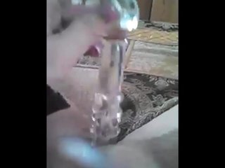 Wife using a glass dildo