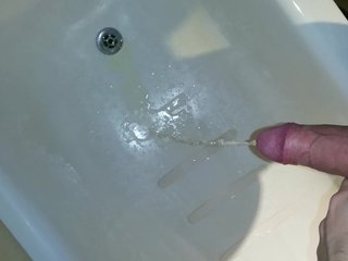 Pissing and strocking on the bathtub